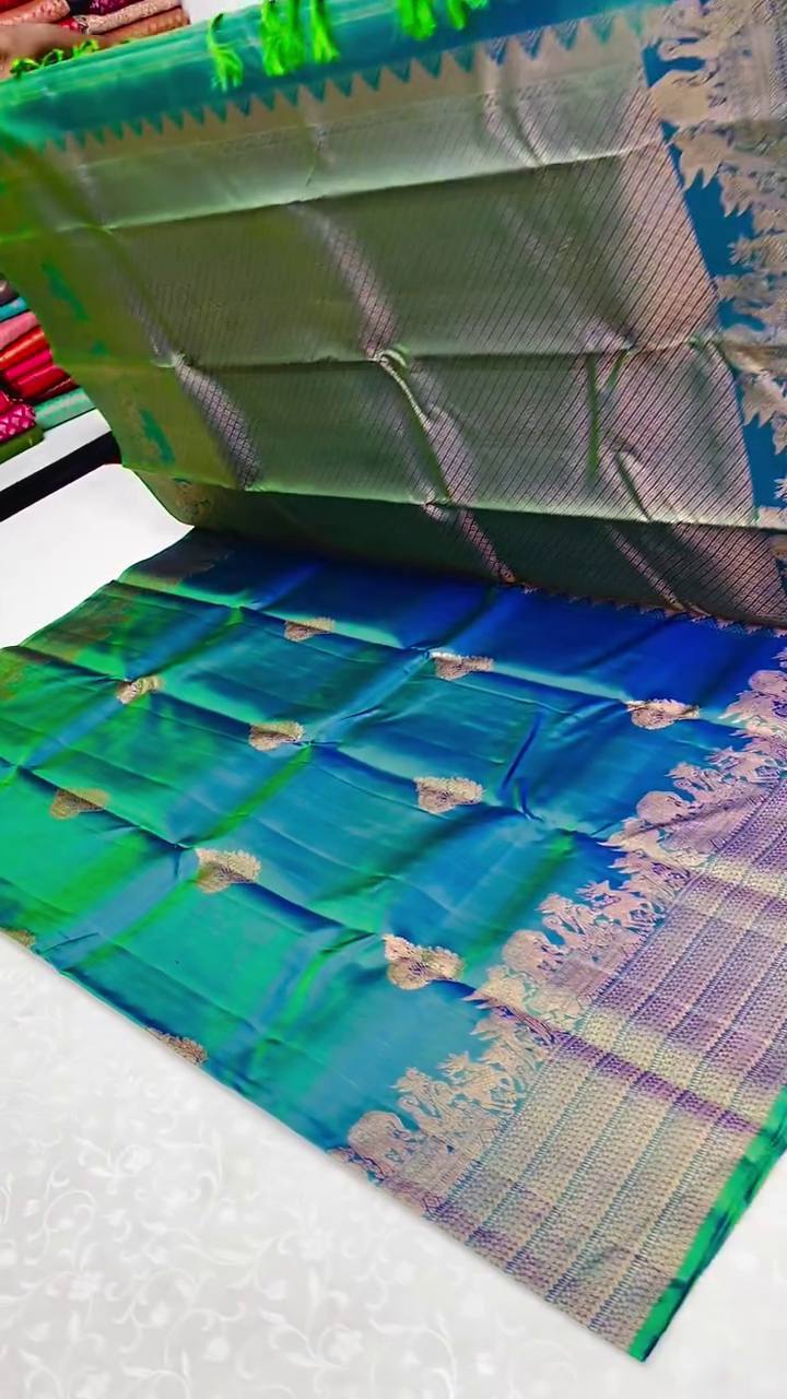 Embellished Rama Soft Banarasi Silk Saree With Gossamer Blouse Piece