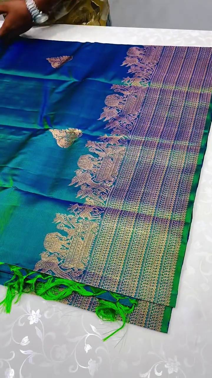 Embellished Rama Soft Banarasi Silk Saree With Gossamer Blouse Piece
