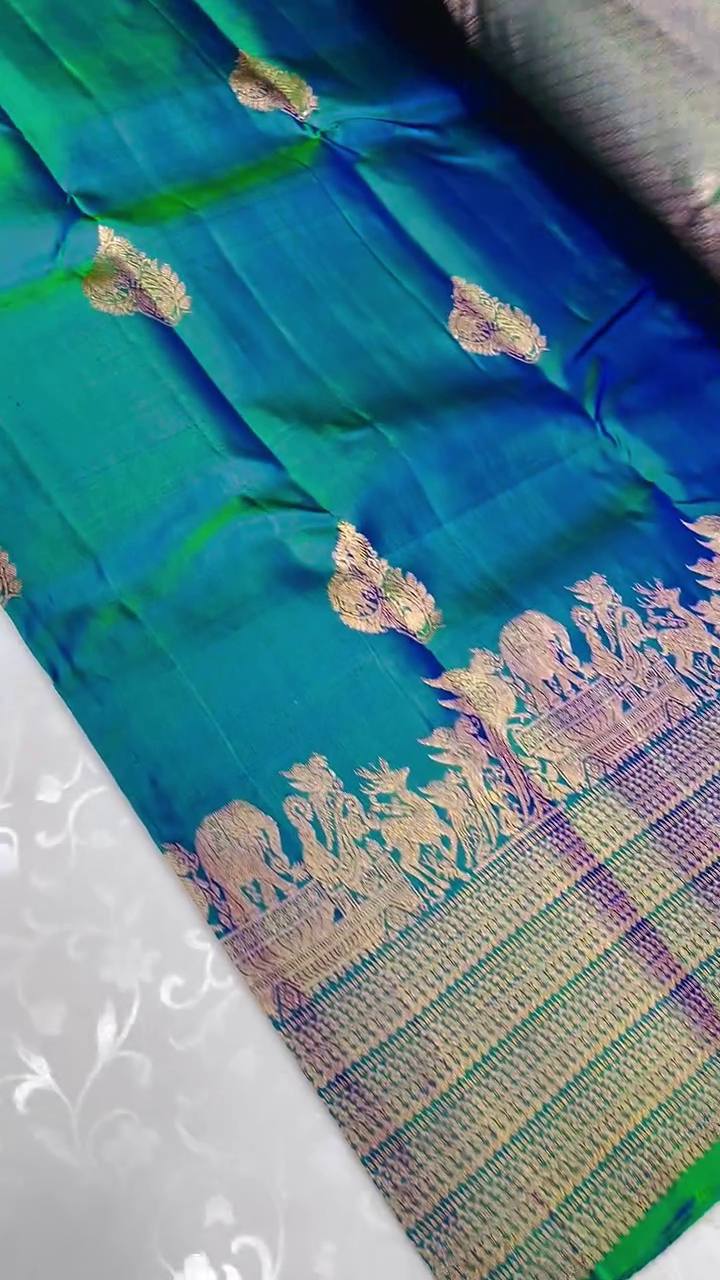 Embellished Rama Soft Banarasi Silk Saree With Gossamer Blouse Piece