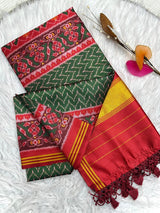 Jubilant Dark Green Ikkat Printed Patola Silk Saree With Entrancing Blouse Piece