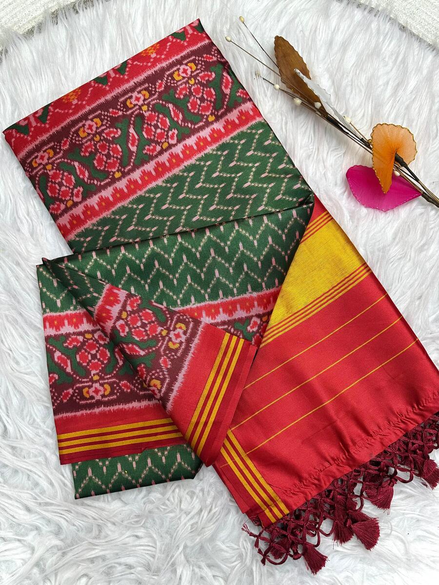 Jubilant Dark Green Ikkat Printed Patola Silk Saree With Entrancing Blouse Piece