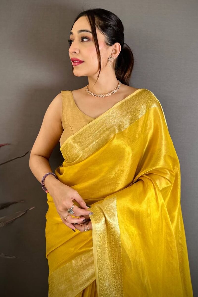 Unique Golden Banarasi Tissue Silk Saree With Diaphanous Blouse Piece