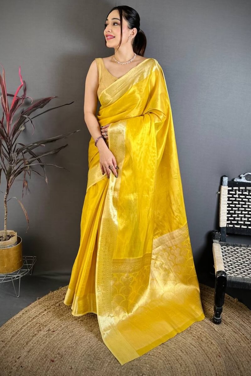 Unique Golden Banarasi Tissue Silk Saree With Diaphanous Blouse Piece