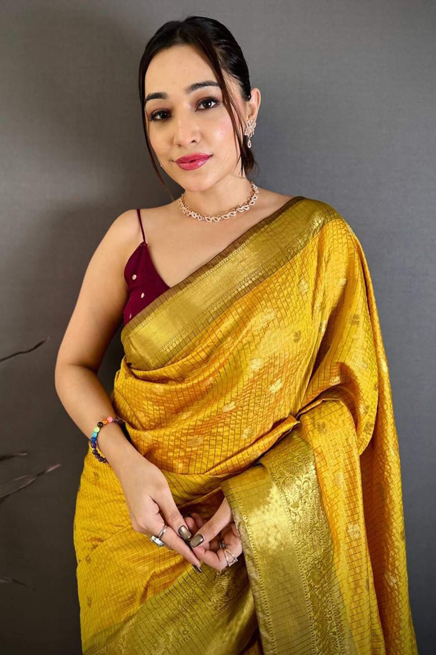 Pleasant Yellow Banarasi Tissue Silk Saree With Tantalizing Blouse Piece