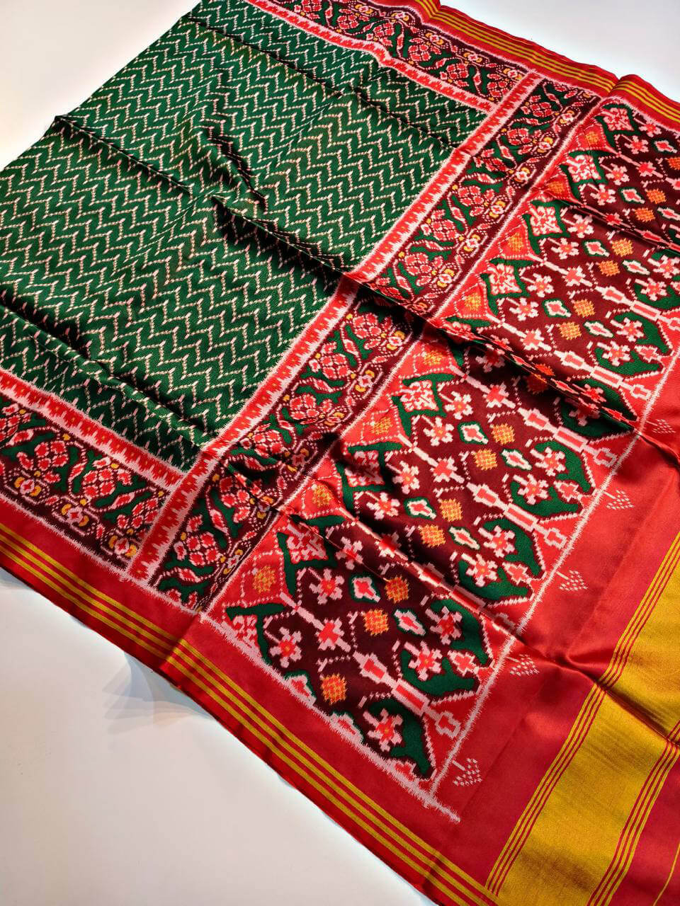 Ideal Dark Green Patola Lagdi Patta Saree With Desuetude Blouse Piece
