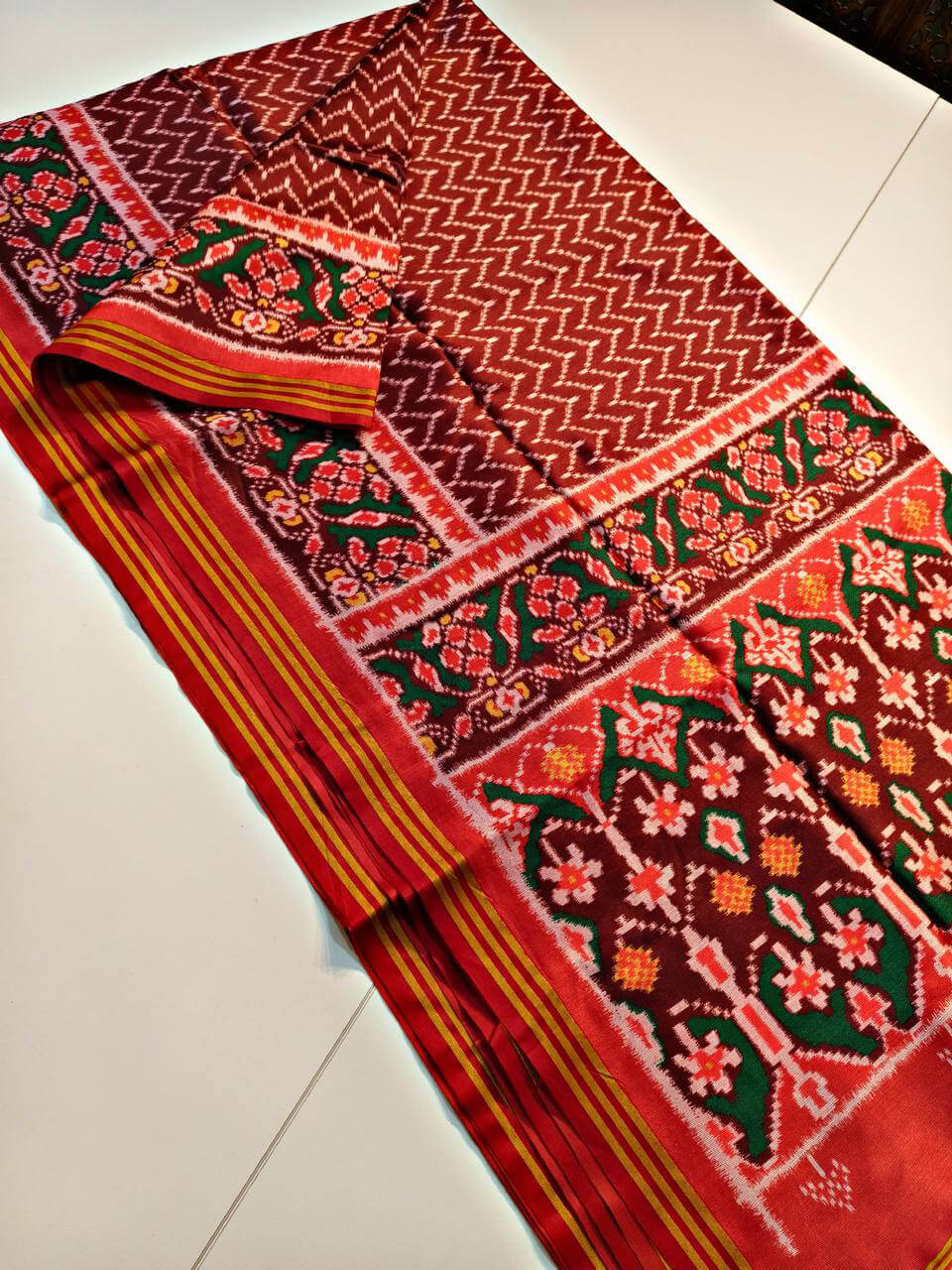 Ornate Maroon Patola Lagdi Patta Saree With Arresting Blouse Piece