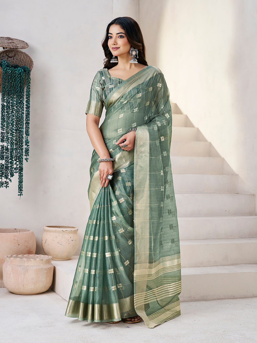 Flattering Green Zari Weaving Linen Silk Saree With Embrocation Blouse Piece