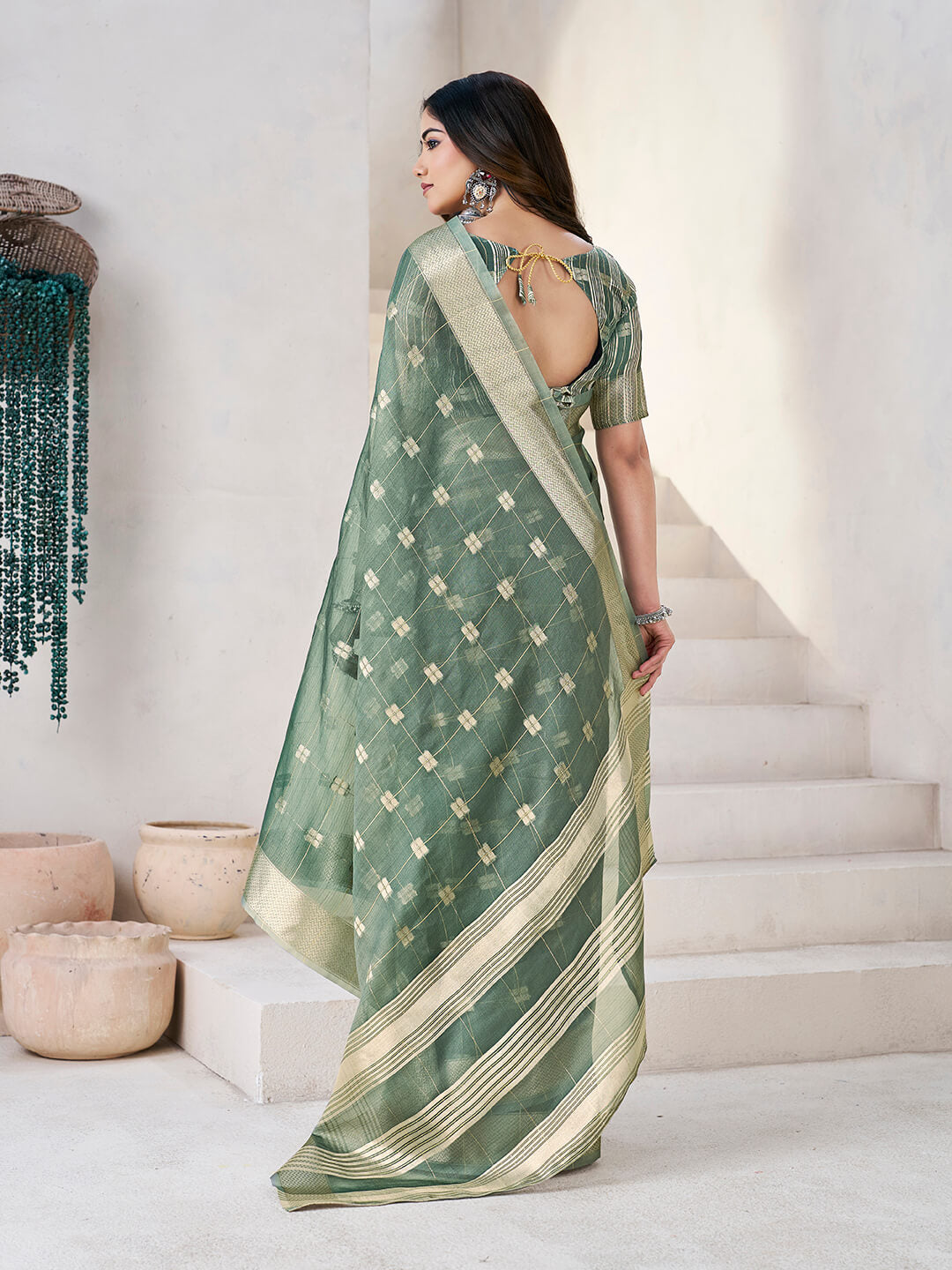 Flattering Green Zari Weaving Linen Silk Saree With Embrocation Blouse Piece