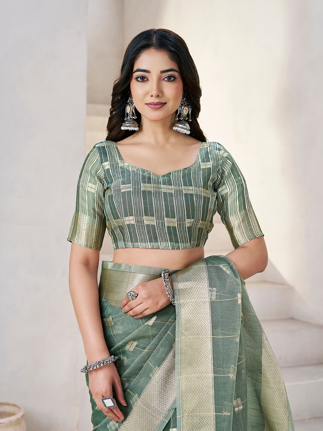 Flattering Green Zari Weaving Linen Silk Saree With Embrocation Blouse Piece