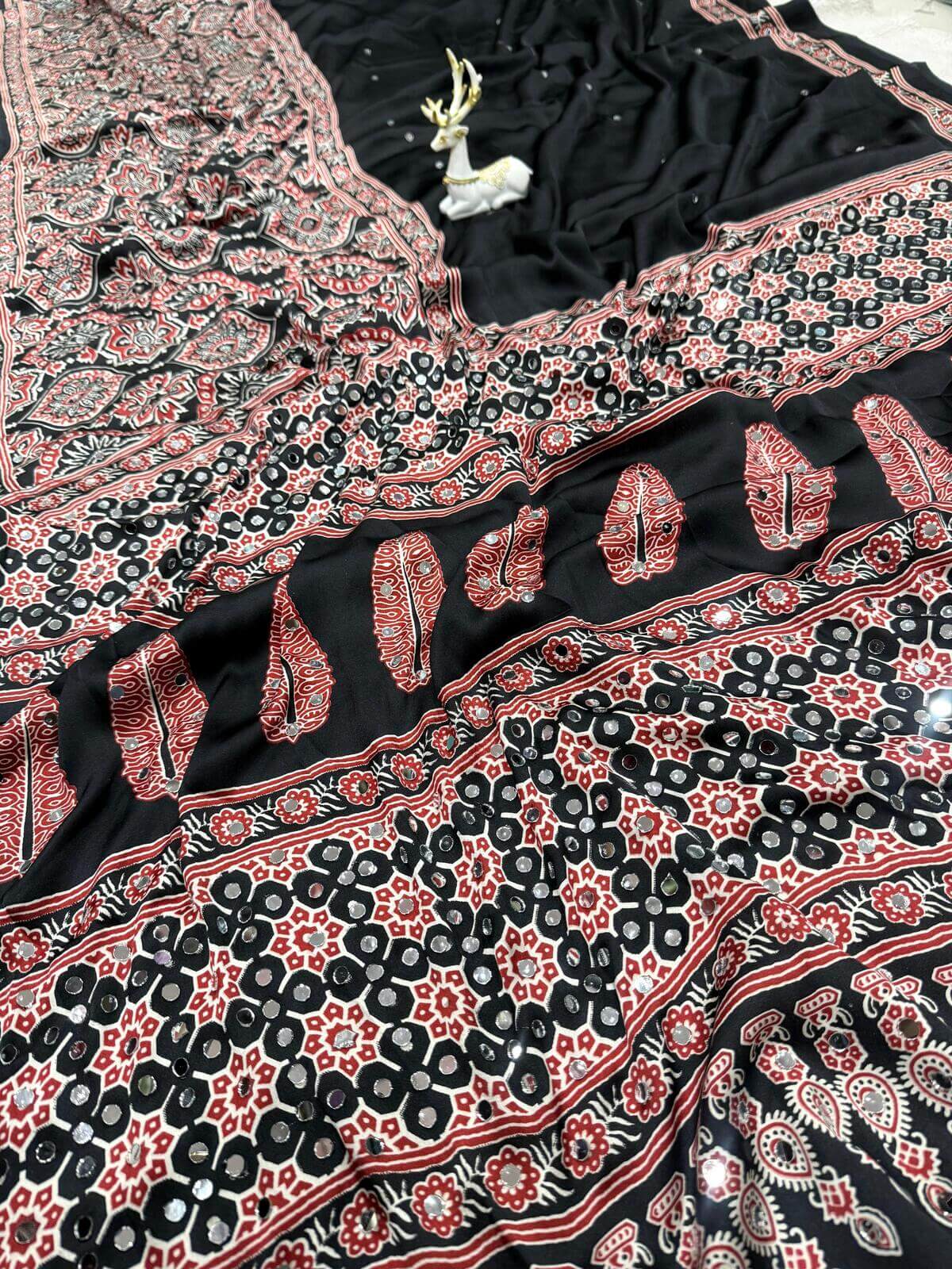 Divine Black Ajrakh Printed Mirror Work Satin Silk Saree With Vibrant Blouse Piece