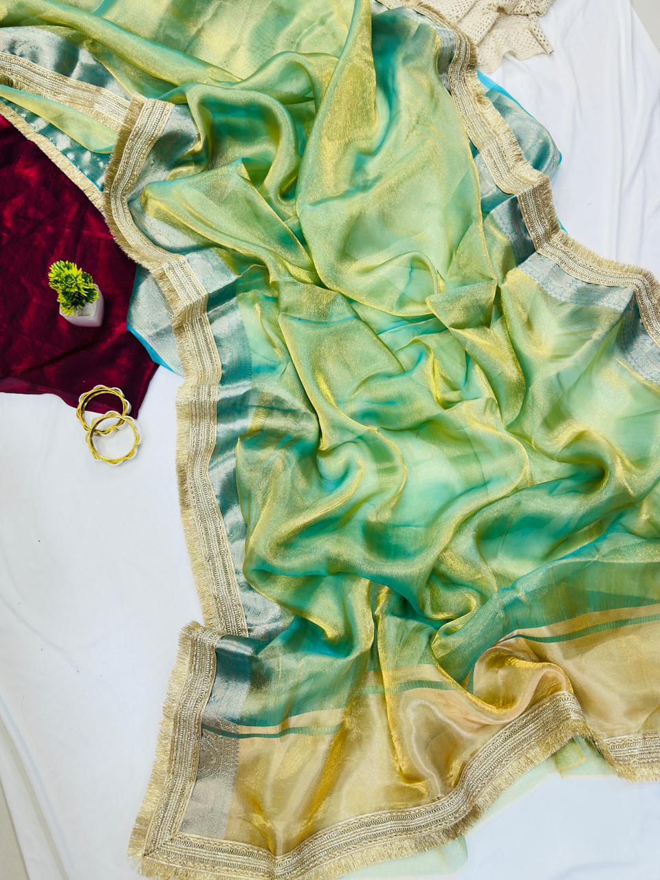 Sizzling Pista Tissue Silk Saree With Vestigial Blouse Piece