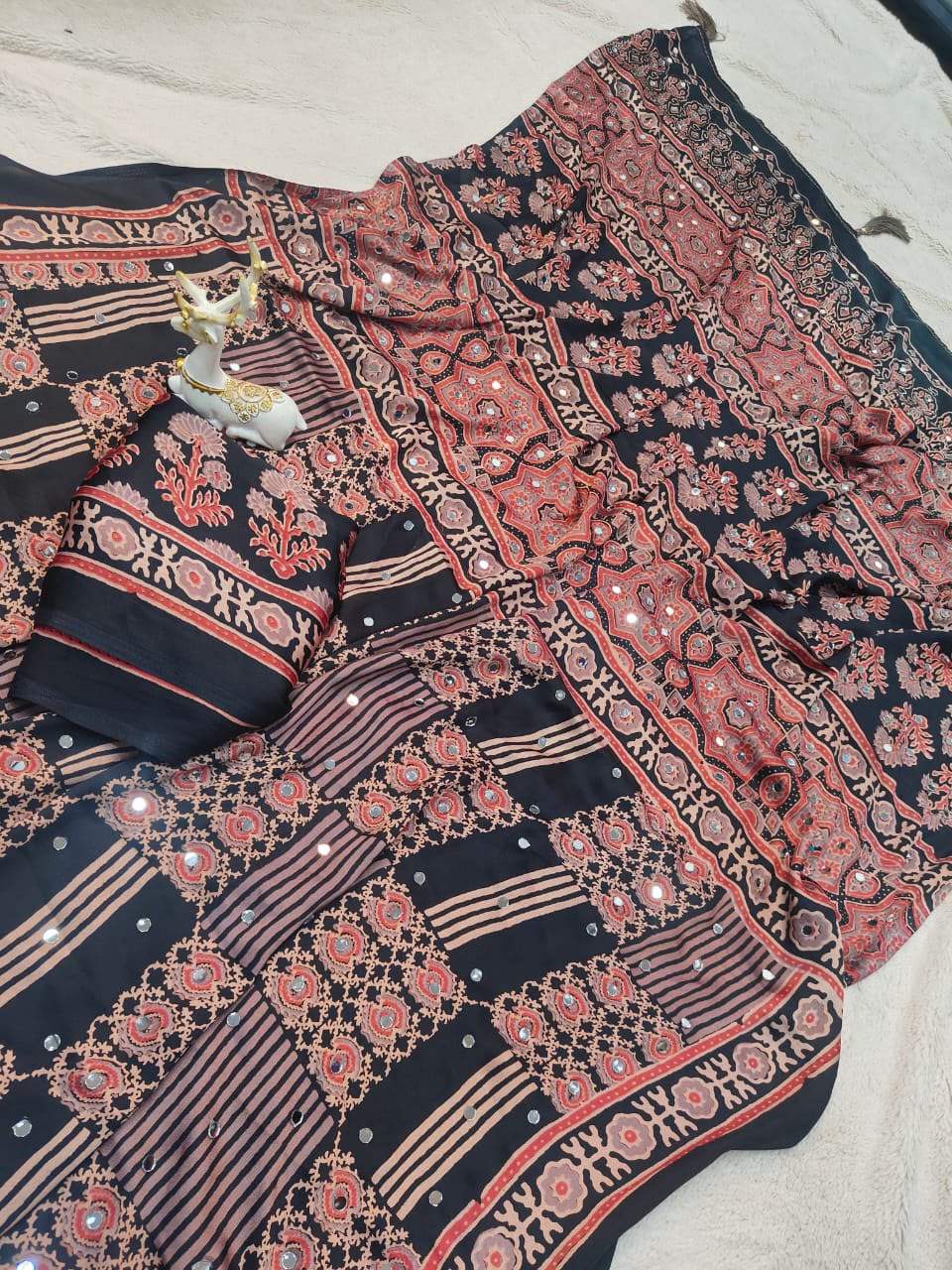 Lissome Black Ajrakh Printed Mirror Work Satin Silk Saree With Inspiring Blouse Piece