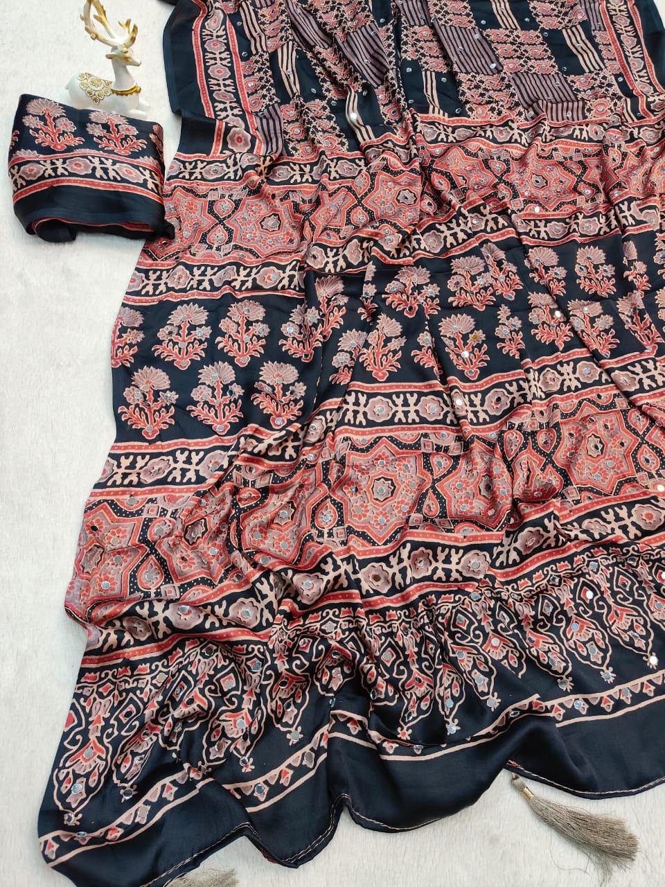 Lissome Black Ajrakh Printed Mirror Work Satin Silk Saree With Inspiring Blouse Piece