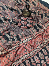 Evanescent Black Ajrakh Printed Dola Silk Saree With Woebegone Blouse Piece