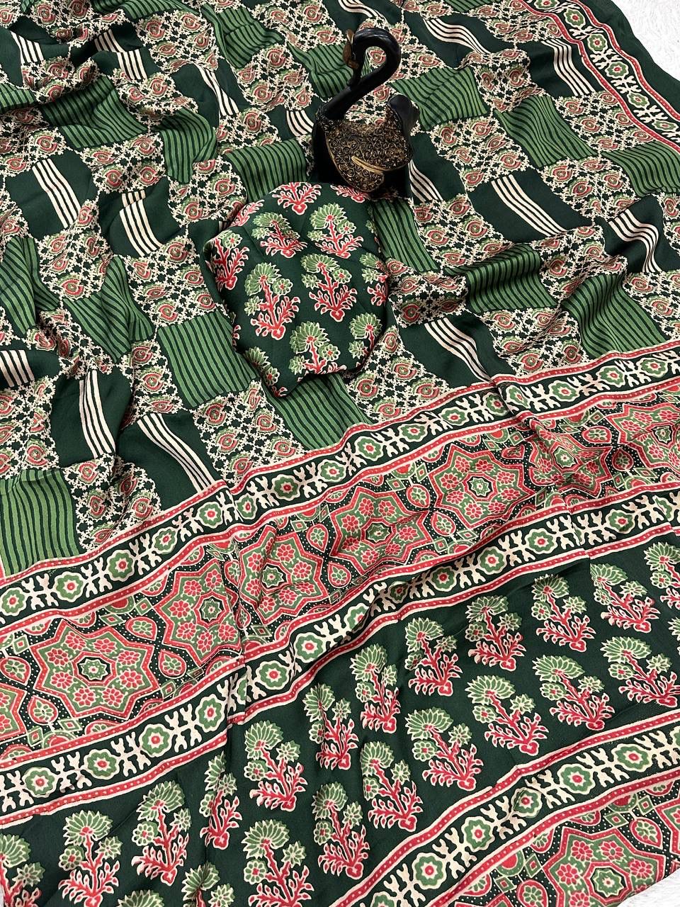 Adorning Green Ajrakh Printed Dola Silk Saree With Gratifying Blouse Piece