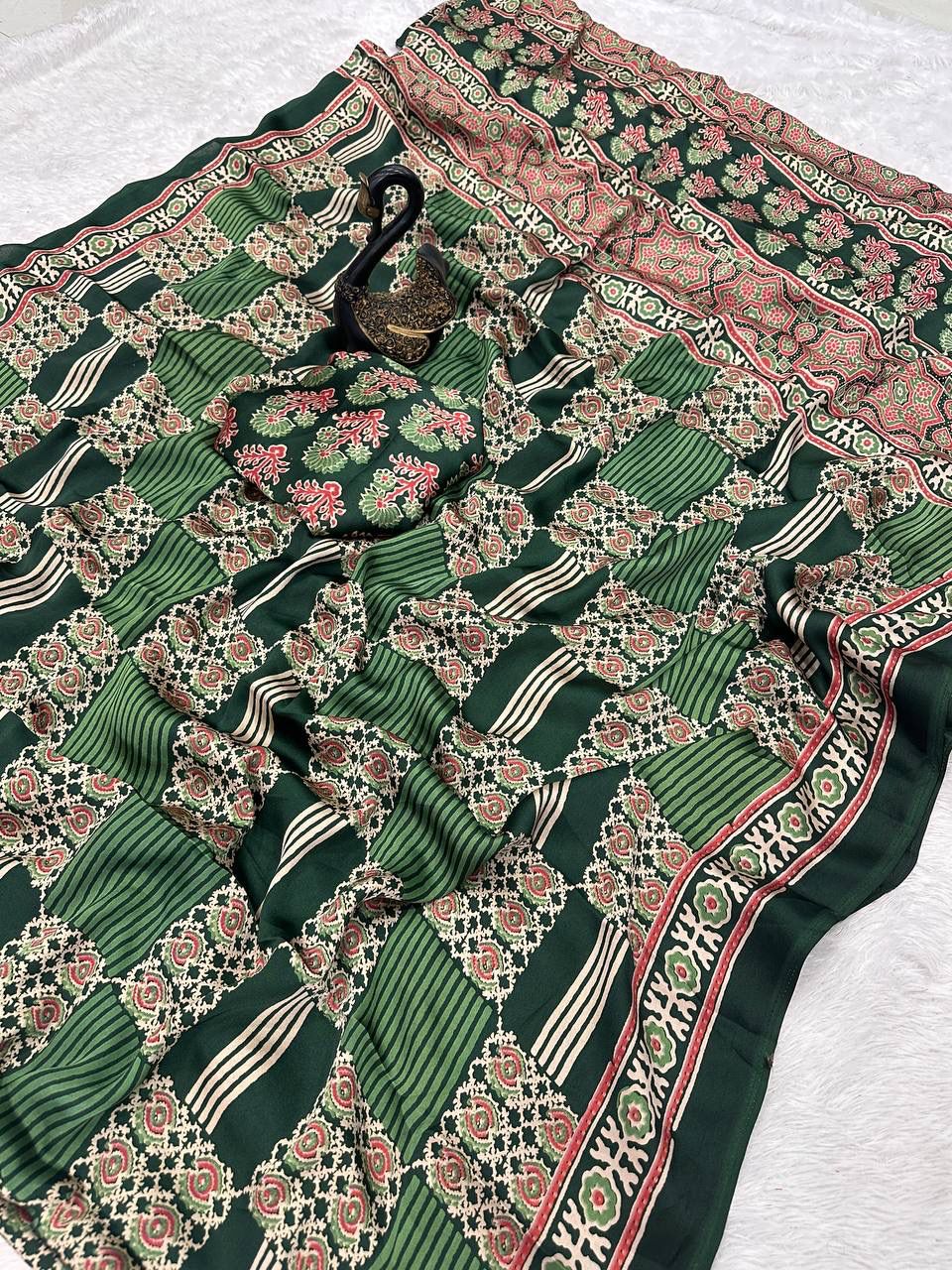 Adorning Green Ajrakh Printed Dola Silk Saree With Gratifying Blouse Piece