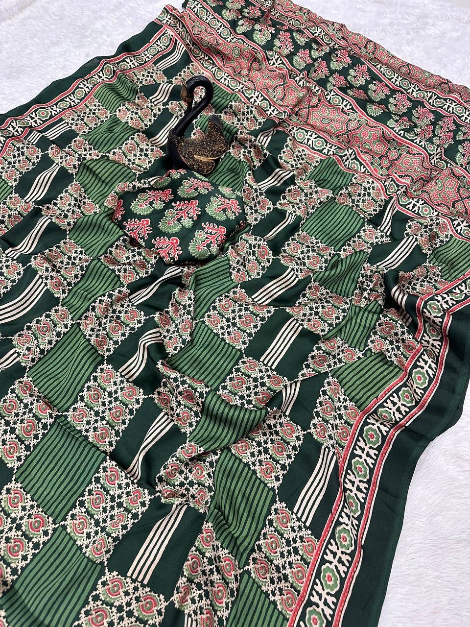 Adorning Green Ajrakh Printed Dola Silk Saree With Gratifying Blouse Piece