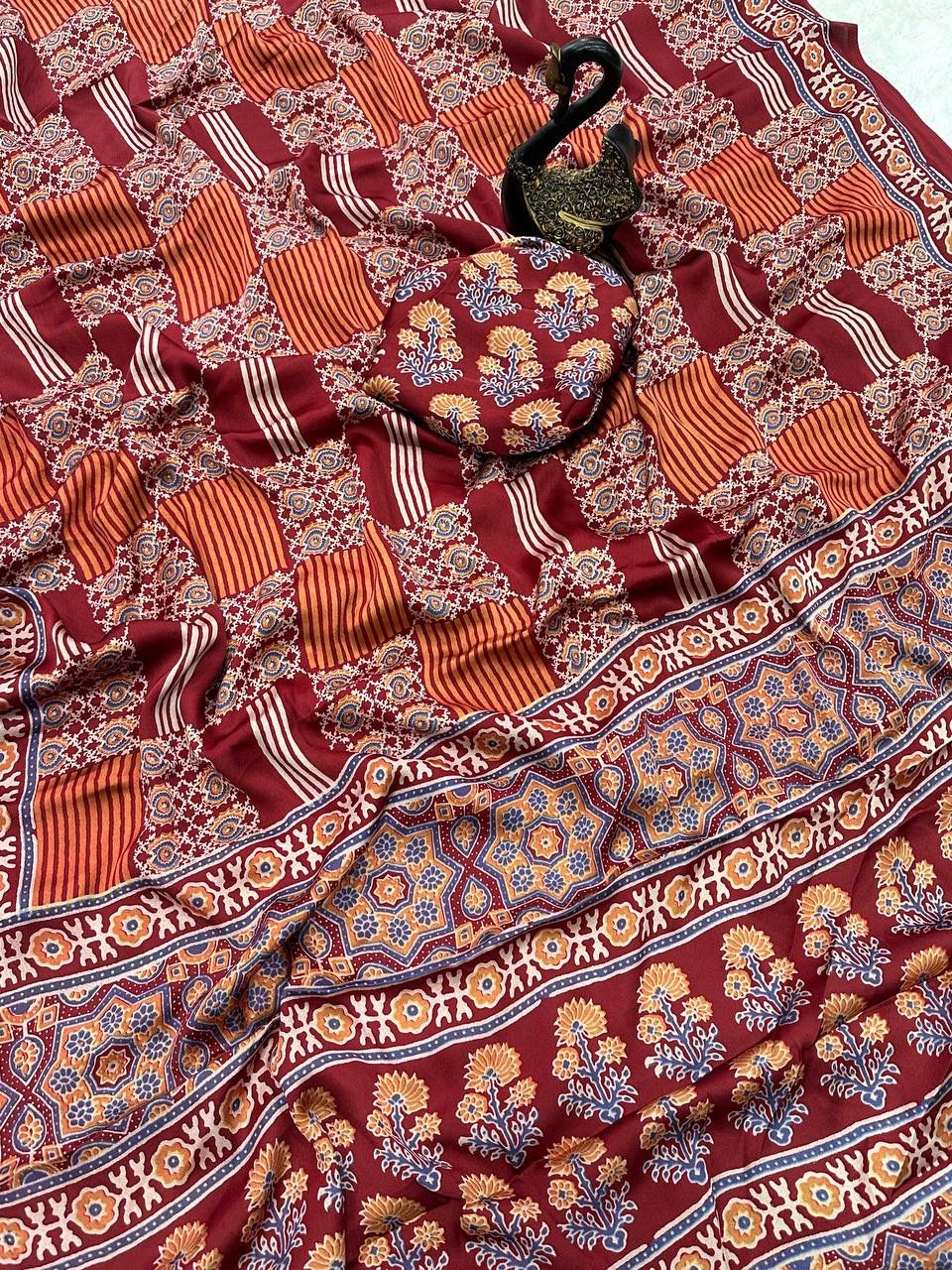 Desiring Maroon Ajrakh Printed Dola Silk Saree With Classic Blouse Piece