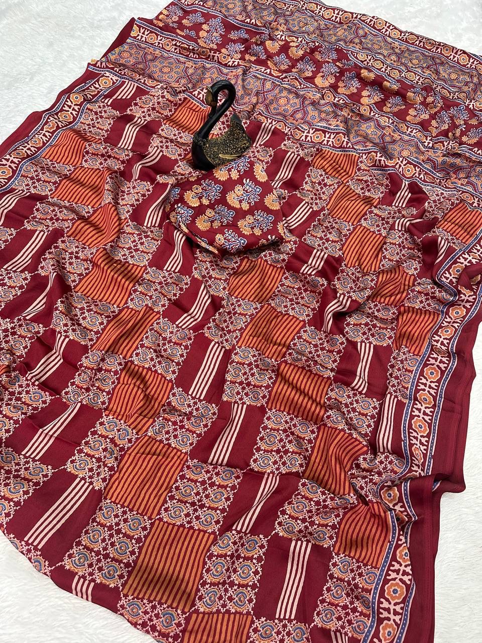 Desiring Maroon Ajrakh Printed Dola Silk Saree With Classic Blouse Piece