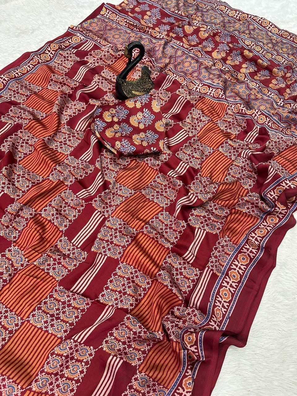 Desiring Maroon Ajrakh Printed Dola Silk Saree With Classic Blouse Piece