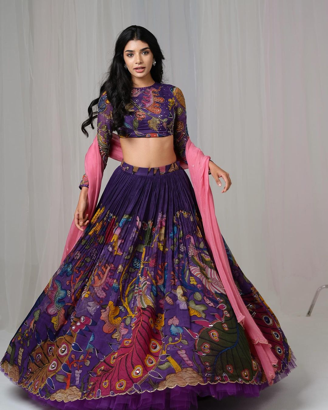 Traditional purple kalamkari lehenga set with peacock motif and pink dupatta mameraa