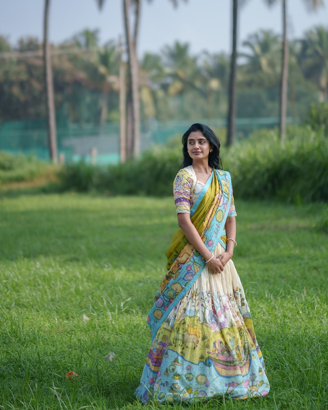 Cream and mustard kalamkari lehenga with pastoral motif and blue border
