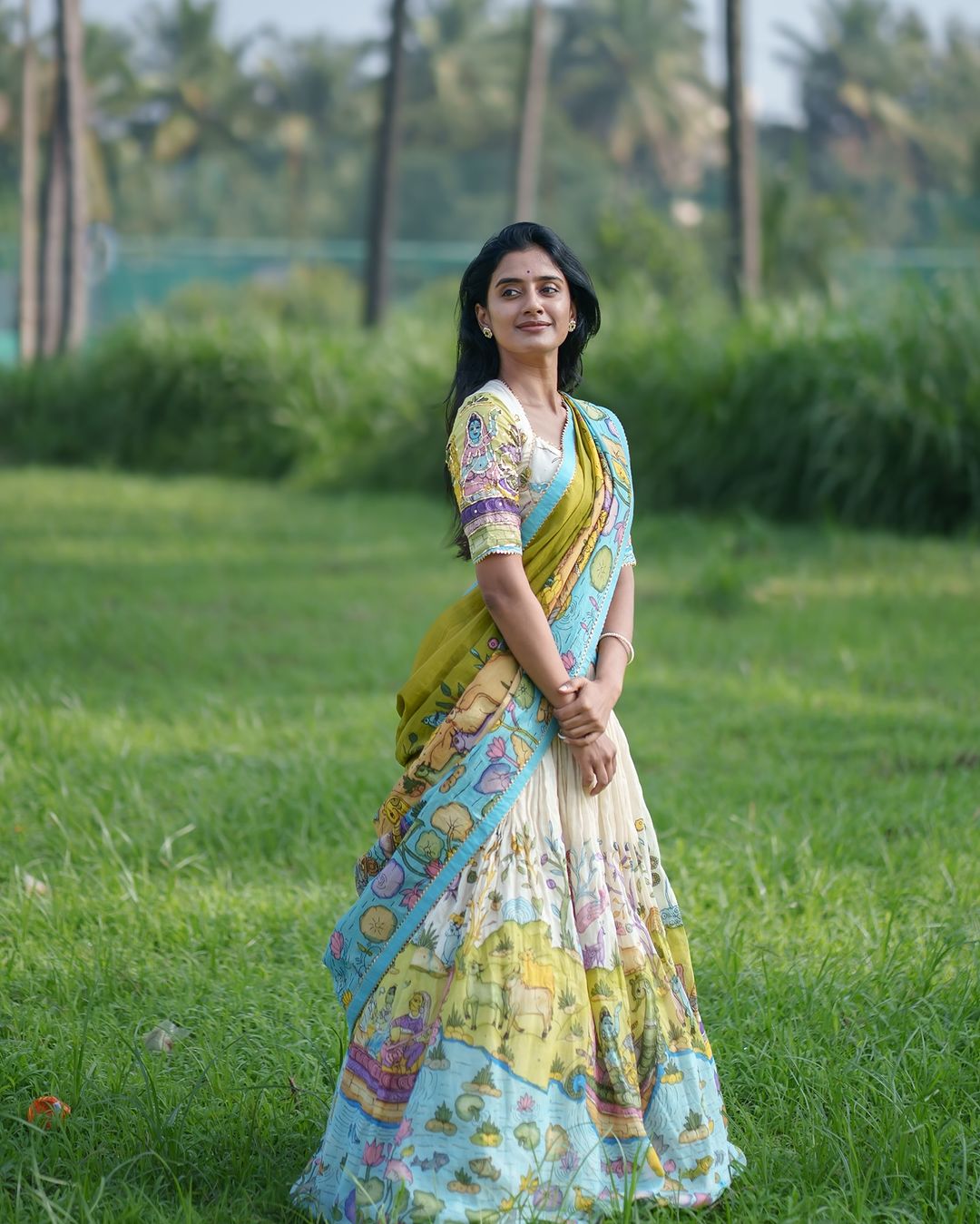 Cream and mustard kalamkari lehenga with pastoral motif and blue border