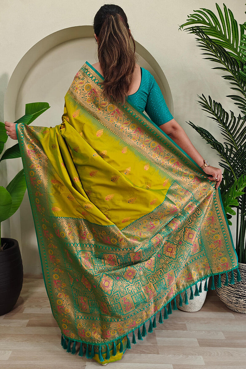 Cynosure Mehndi Soft Banarasi Silk Saree With Glowing Blouse Piece