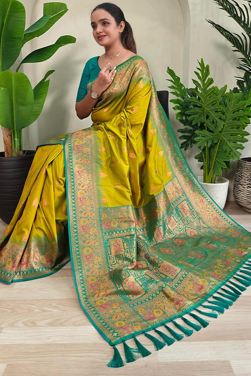 Cynosure Mehndi Soft Banarasi Silk Saree With Glowing Blouse Piece