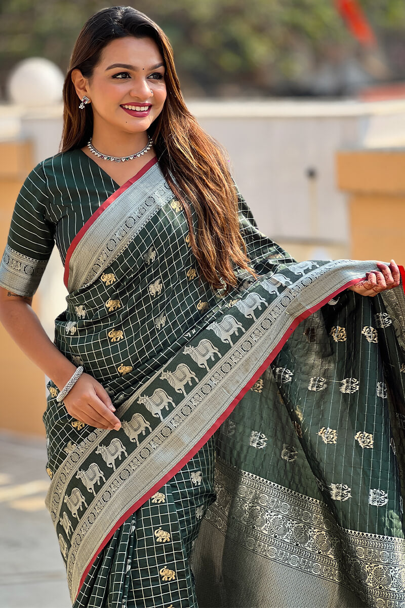 Ephemeral Dark Green Soft Banarasi Silk Saree With Phenomenal Blouse Piece