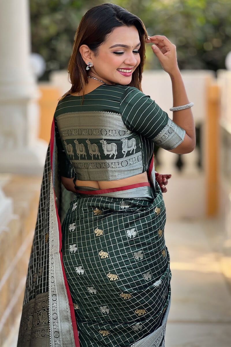 Ephemeral Dark Green Soft Banarasi Silk Saree With Phenomenal Blouse Piece