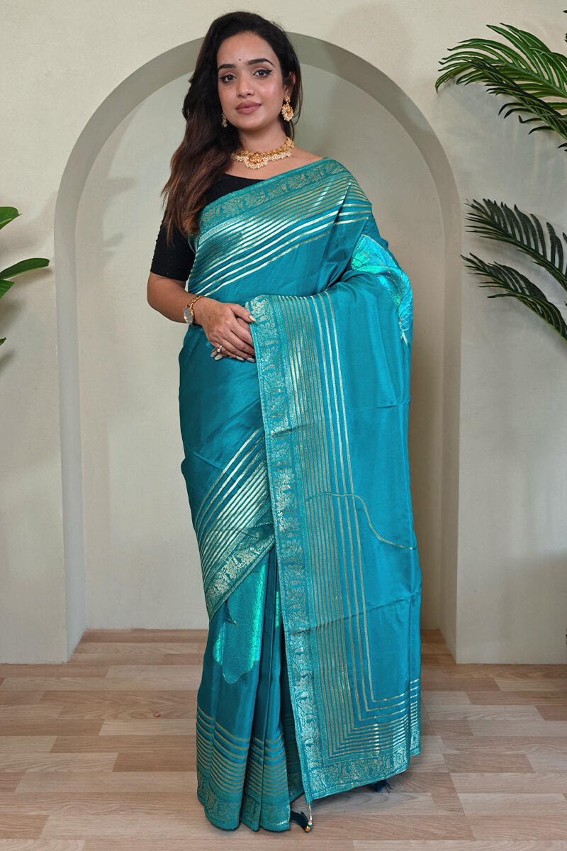 Staring Firozi Soft Banarasi Silk Saree With Jazzy Blouse Piece