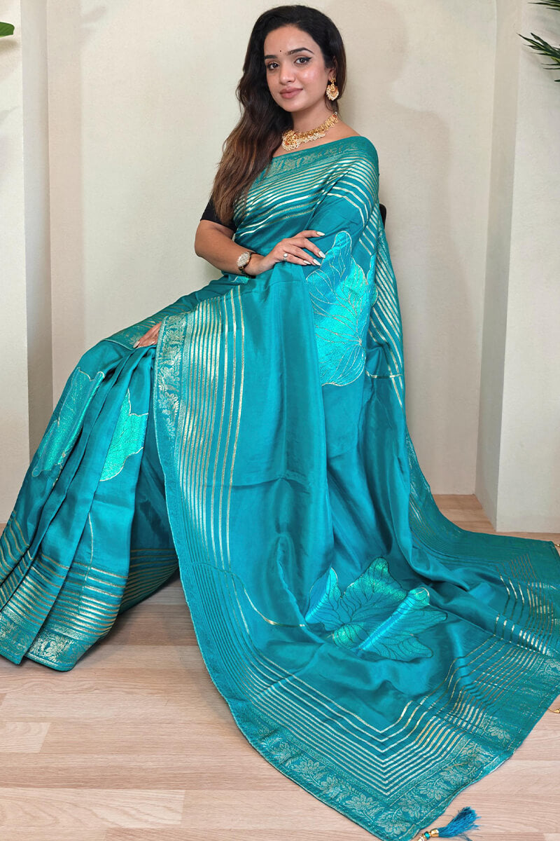 Staring Firozi Soft Banarasi Silk Saree With Jazzy Blouse Piece