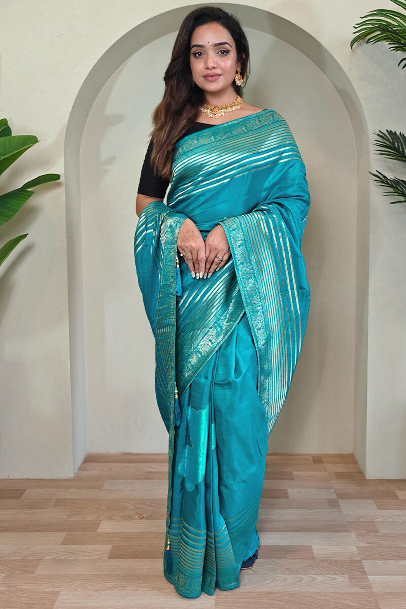 Staring Firozi Soft Banarasi Silk Saree With Jazzy Blouse Piece