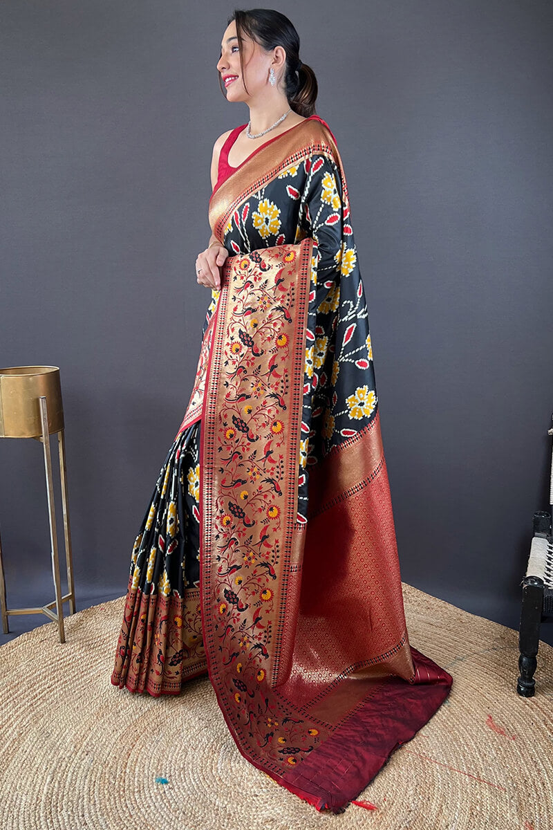 Girlish Black Patola Silk Saree with Surpassing Blouse Piece