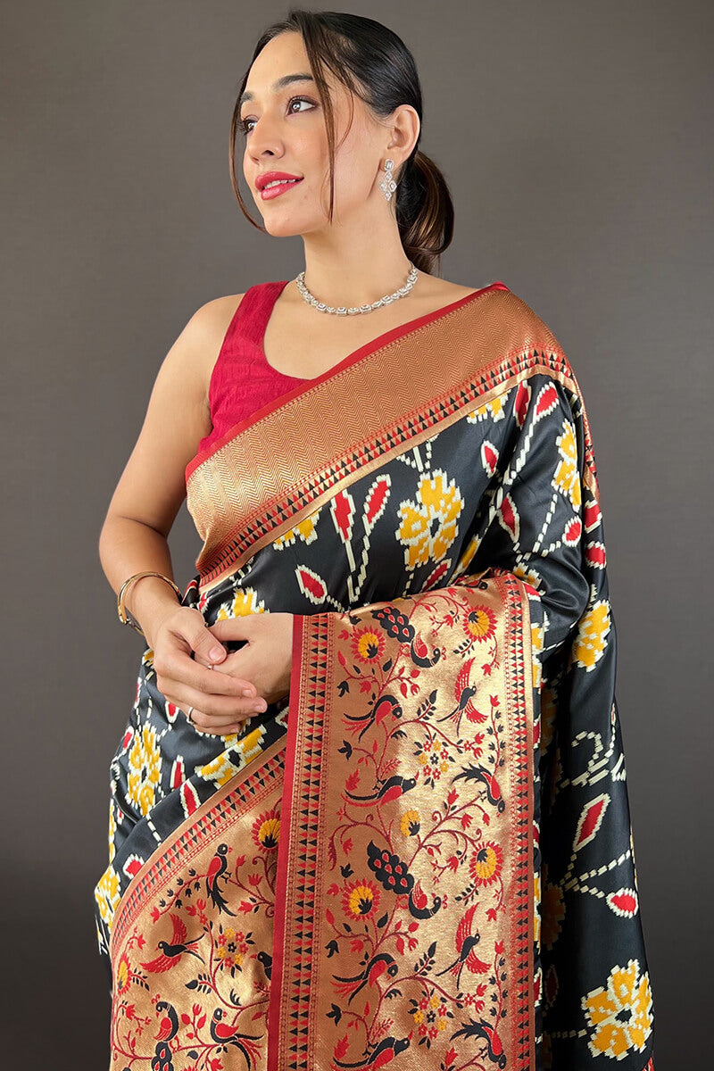 Girlish Black Patola Silk Saree with Surpassing Blouse Piece