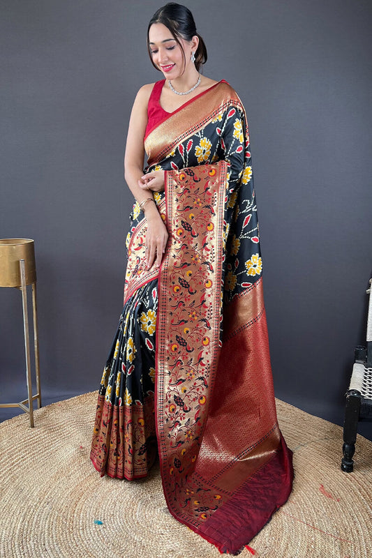 Girlish Black Patola Silk Saree with Surpassing Blouse Piece