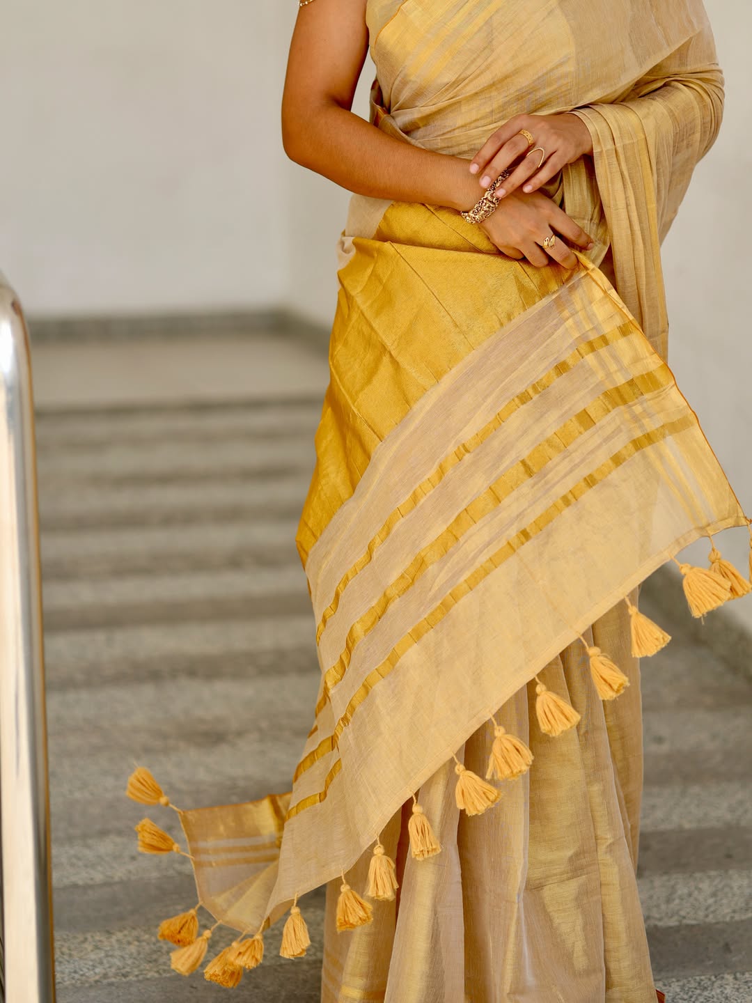 Luxury off white gold kasavu saree with designer tassel pallu