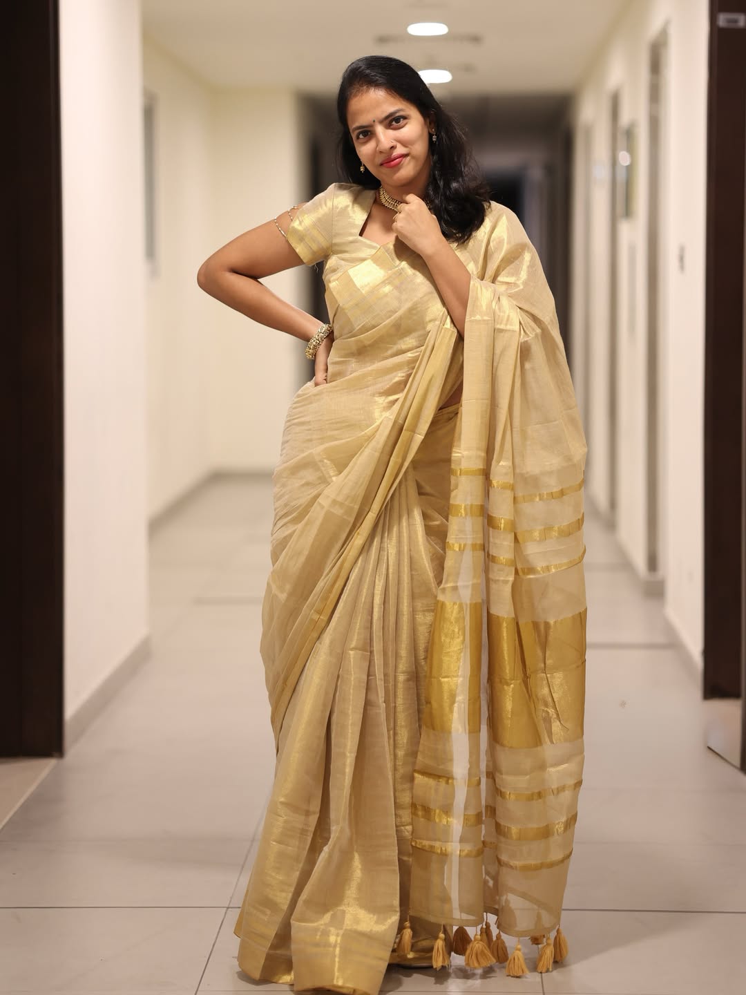 Luxury off white gold kasavu saree with designer tassel pallu