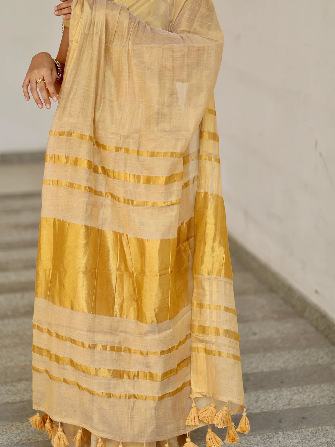 Luxury off white gold kasavu saree with designer tassel pallu