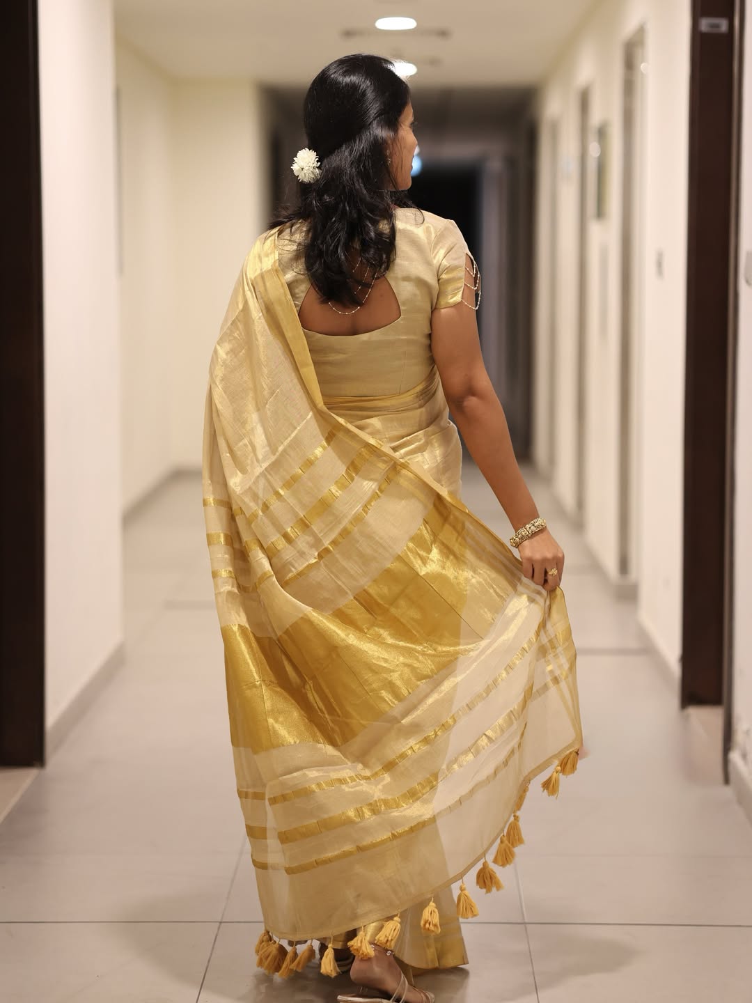 Luxury off white gold kasavu saree with designer tassel pallu