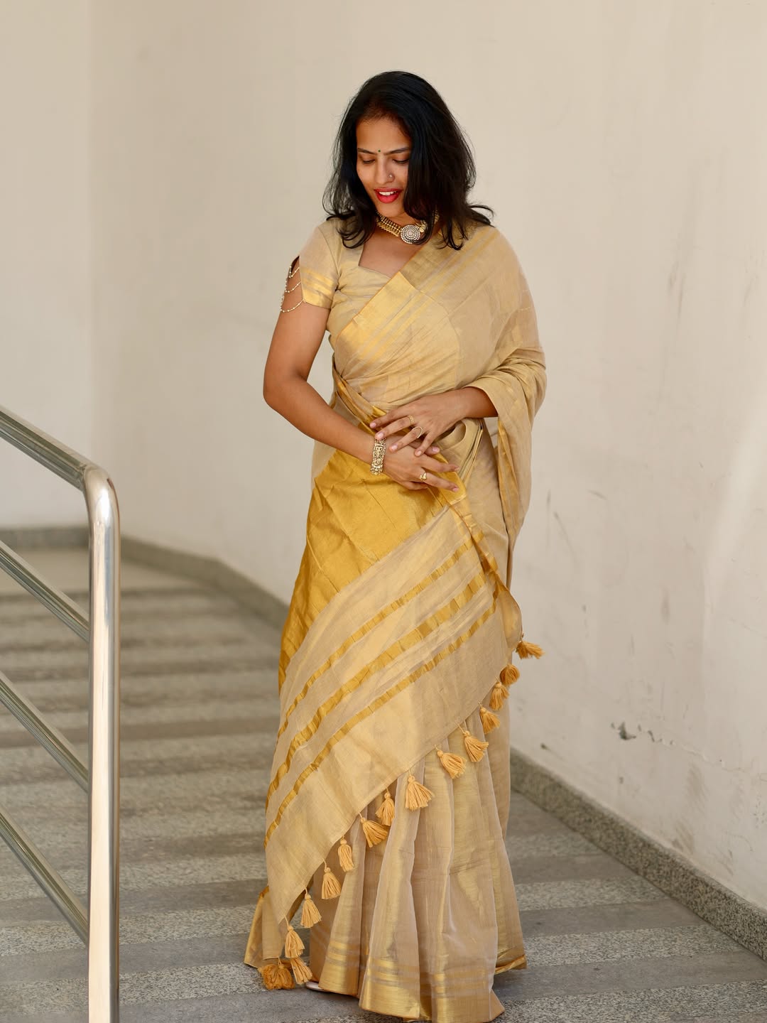 Luxury off white gold kasavu saree with designer tassel pallu