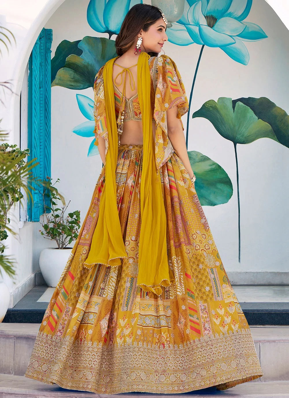 Trendy yellow chinnon silk embroidered lehenga choli with chiffon dupatta for women