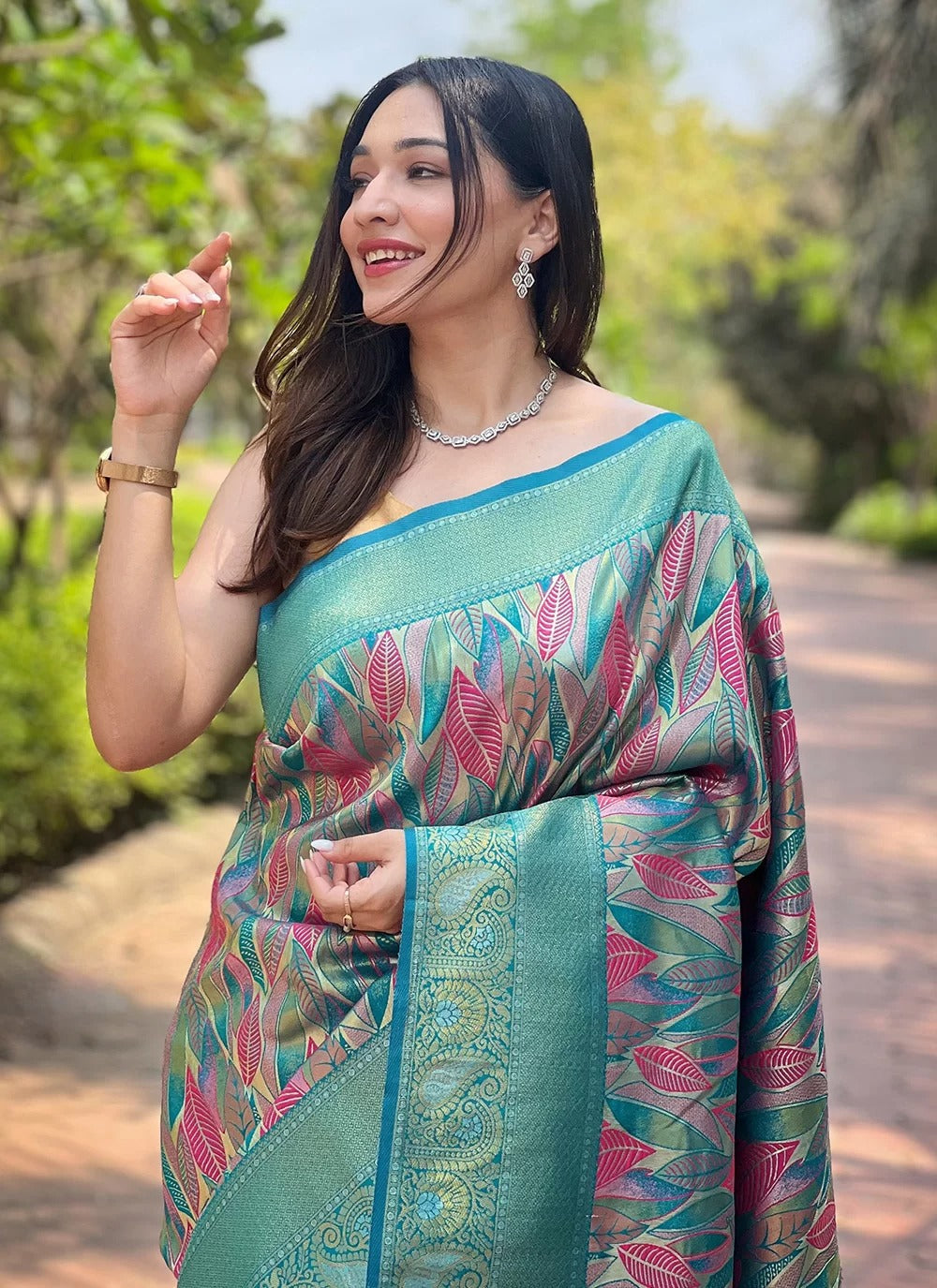 Turquoise kanchipattu silk party wear saree with all over weaves contrast border