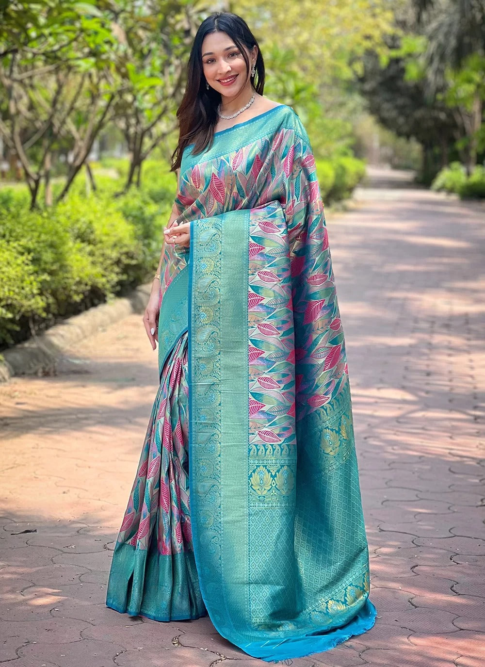 Turquoise kanchipattu silk party wear saree with all over weaves contrast border