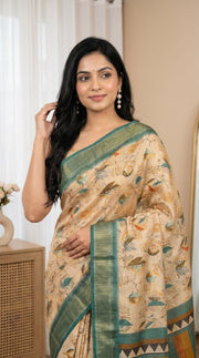 Beige tissue silk saree with teal green border artistic print