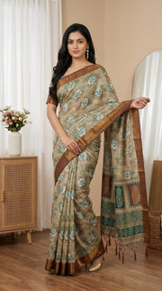 Beige aqua blue floral tissue saree with zari border and tassel pallu mameraa