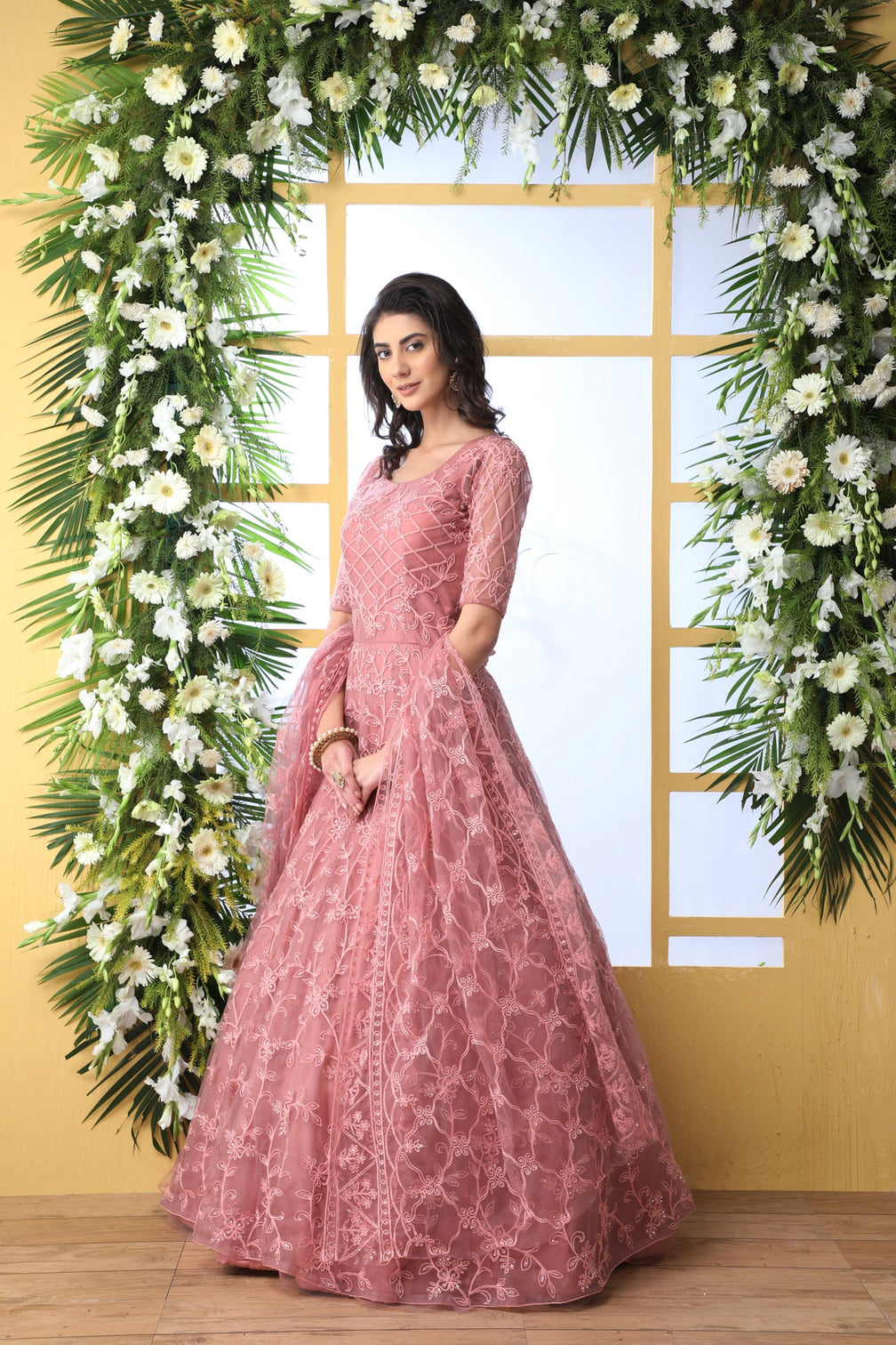 Unique Dusty Peach Colored Party Wear Embroidered Net Gown With Dupatta