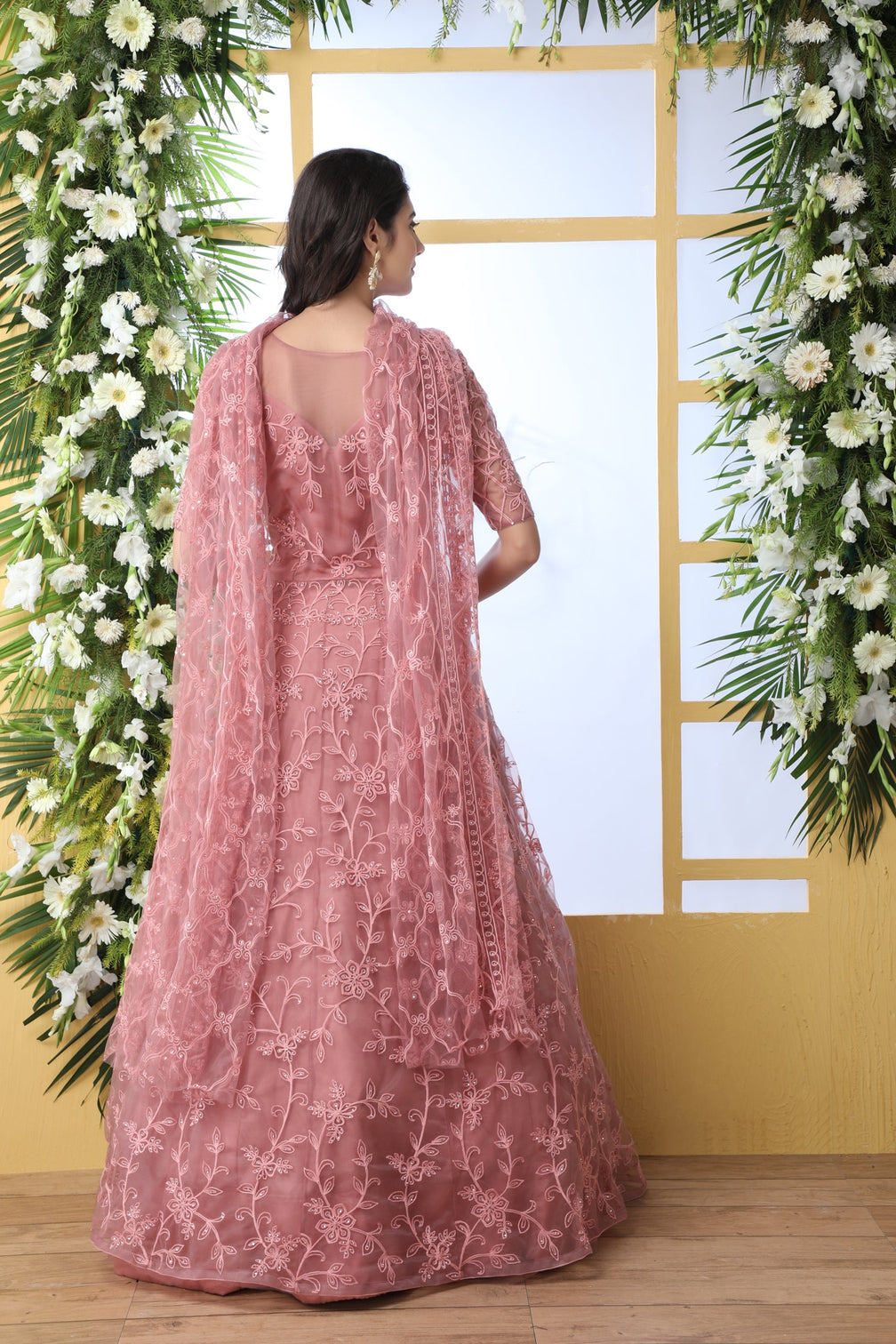 Unique Dusty Peach Colored Party Wear Embroidered Net Gown With Dupatta