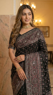 Black modal silk ajrakh printed saree with heritage medallion motifs rich traditional pallu tassel detailing